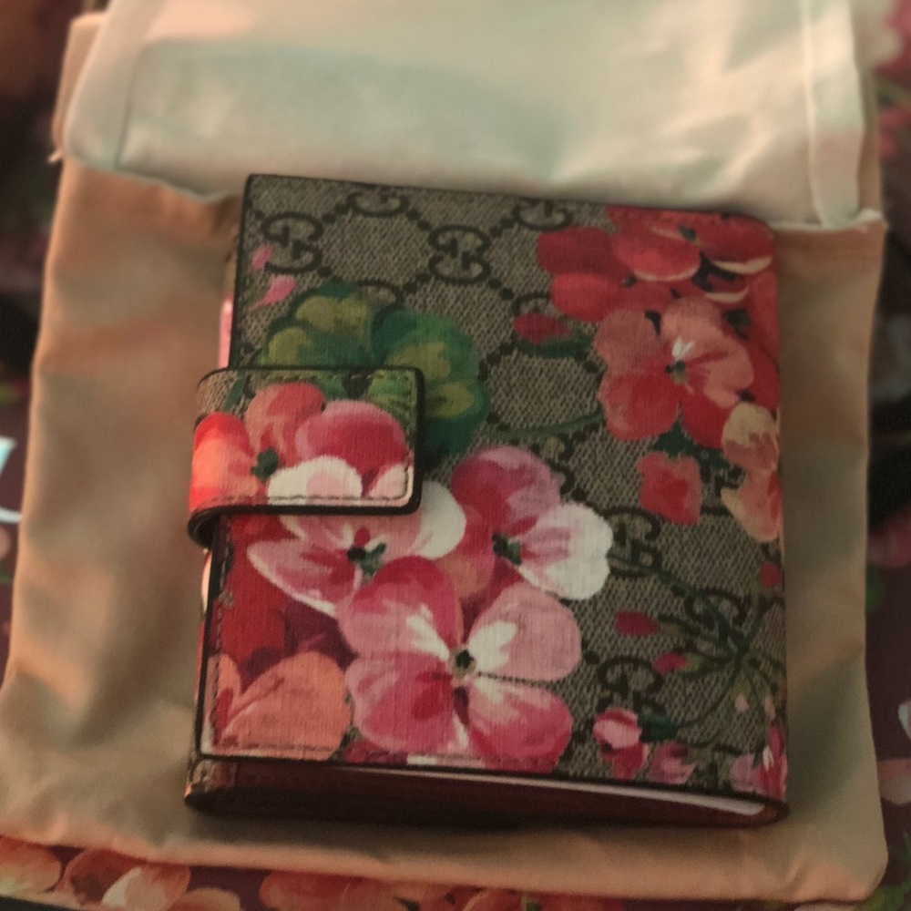 Gucci’s signature Blooms print and double-G wallet